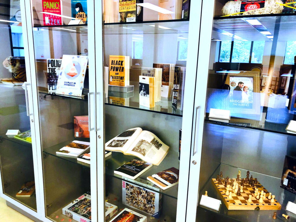 Wide angle view of materials behind a locked glass case