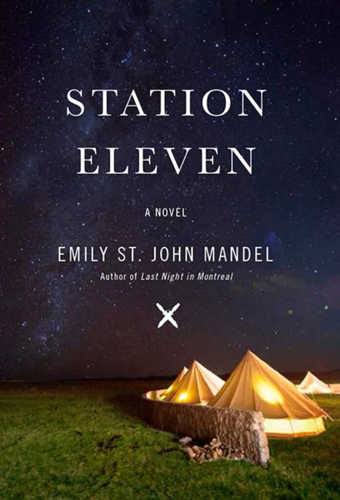 Book cover for Station Eleven by Emily St. John Mandel. The cover features a prominent dark starry sky and in the bottom third of the image there is a camp site surrounded by a brick fence or vibrant green grass.