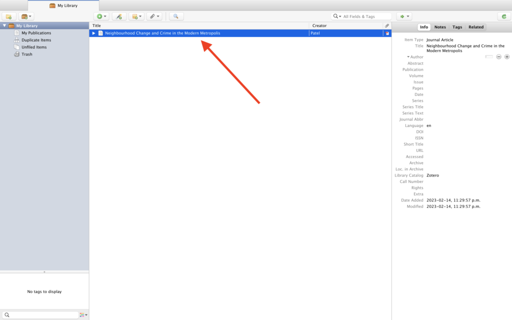 My Library in Zotero App. In the library space, there is a dark blue line (denoting that the file has been selected) that shows the title and creator of the file. A red arrow points to the file, while to the right of the page (in a panel divide by a line) there is the Information about the file.